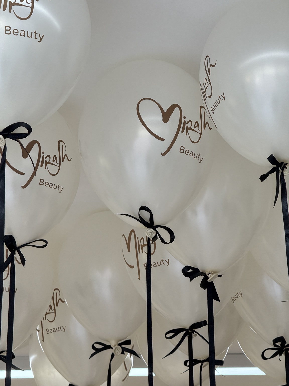 Custom branded balloons for a Dubai beauty business